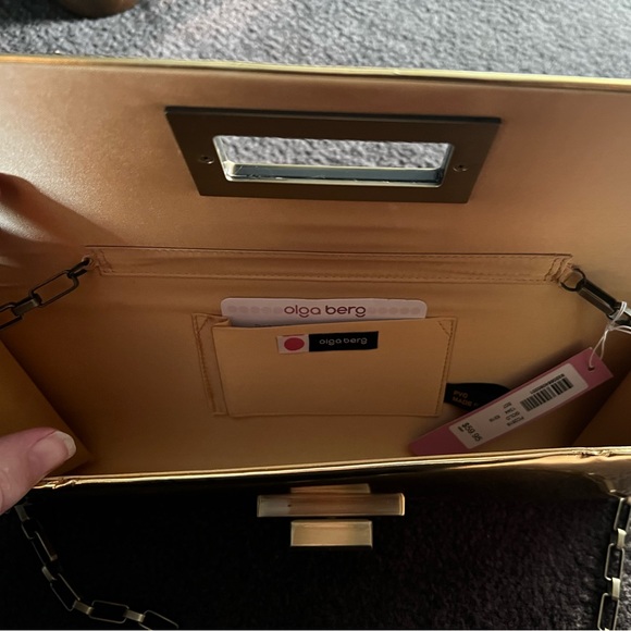 NWT - Olga berg gold clutch bag. NWT. Comes with chain strap. Rectangular clasp. - Picture 7 of 15